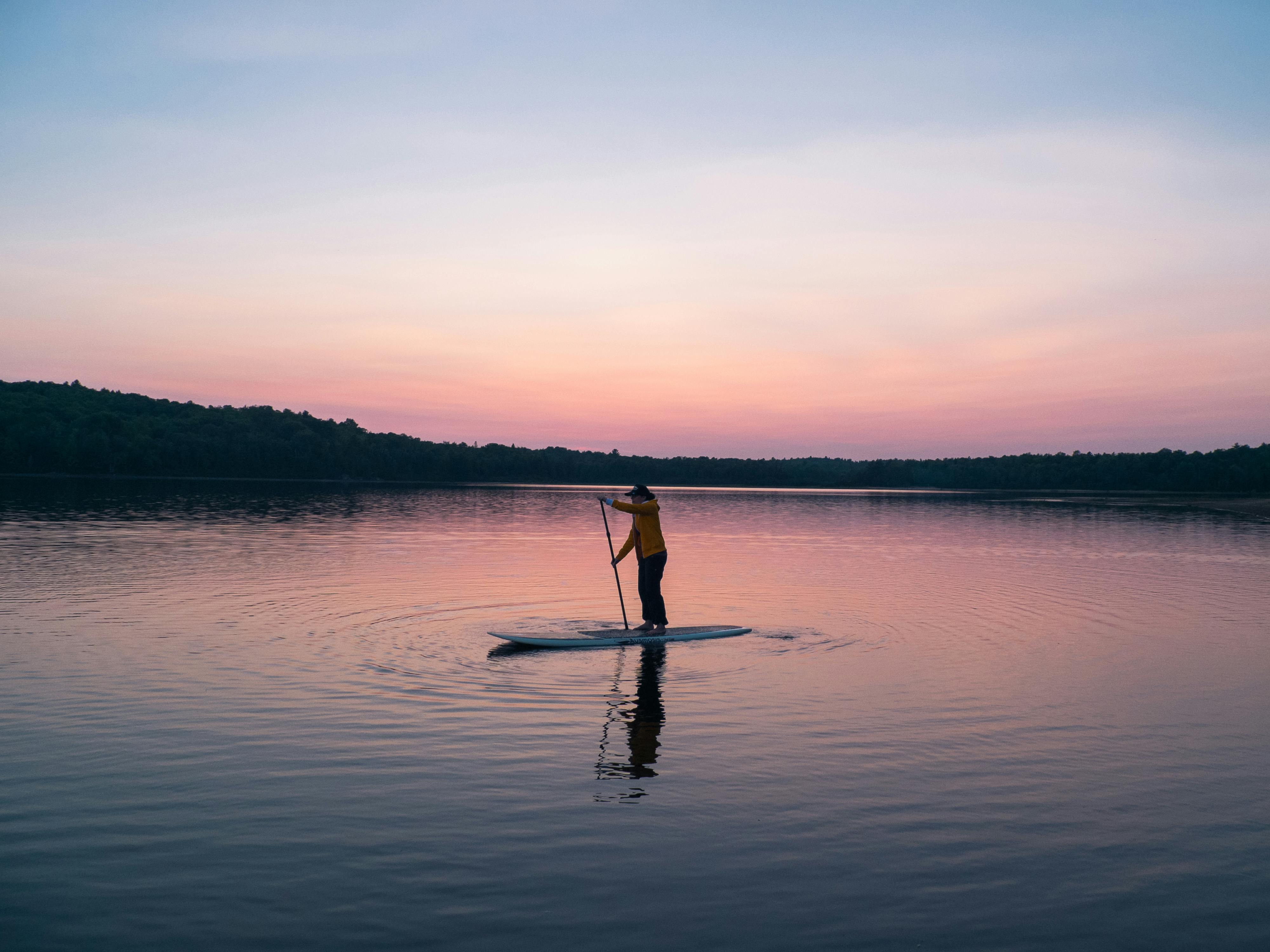 person paddle boarding
