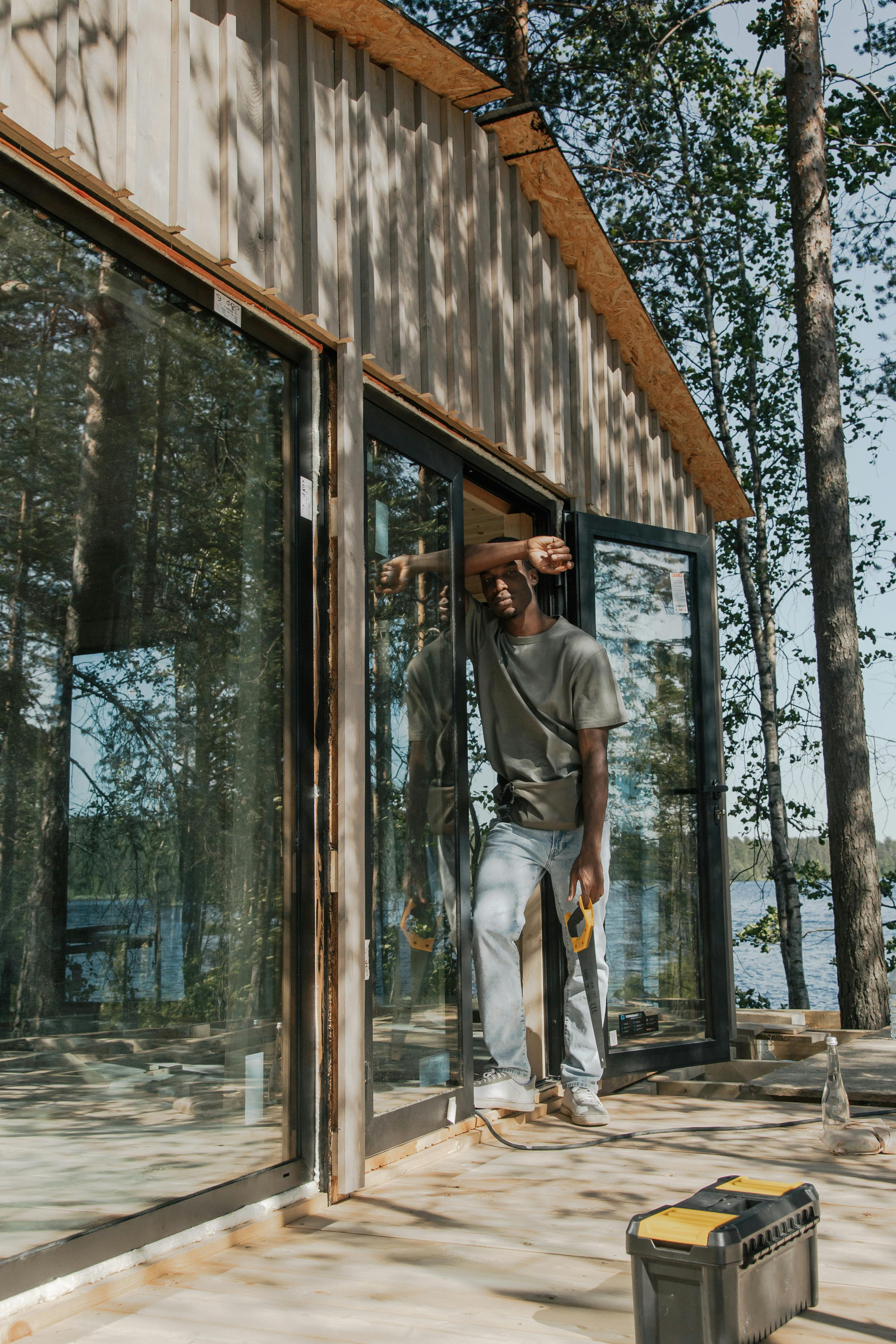 person in front of house